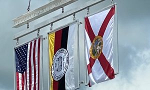 Three flags and the final steel beam used for the Seminole Tribe's new casino