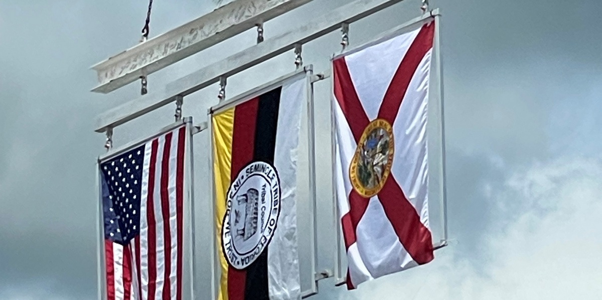 Three flags and the final steel beam used for the Seminole Tribe's new casino