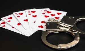 playing cards and handcuffs