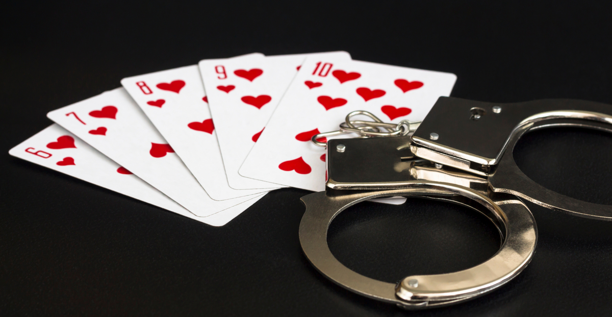 playing cards and handcuffs