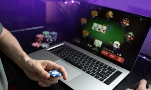 A young man playing online poker