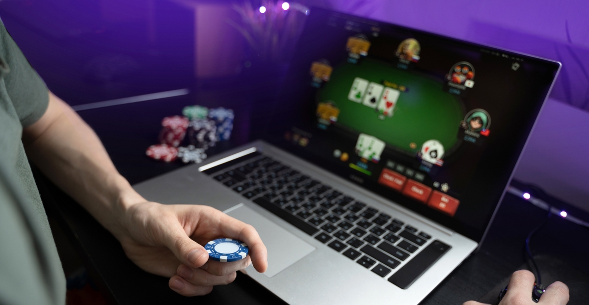 A young man playing online poker