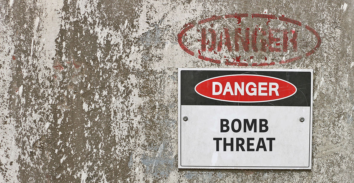 Concrete wall with sign reading 